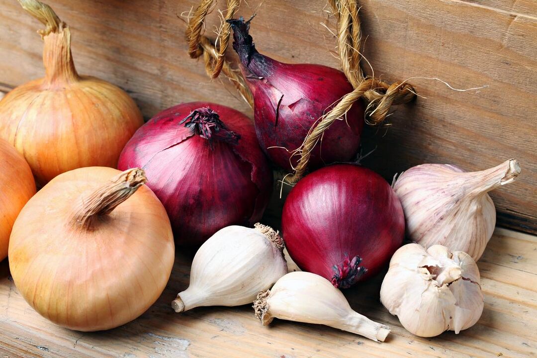 garlic and onion against mushrooms